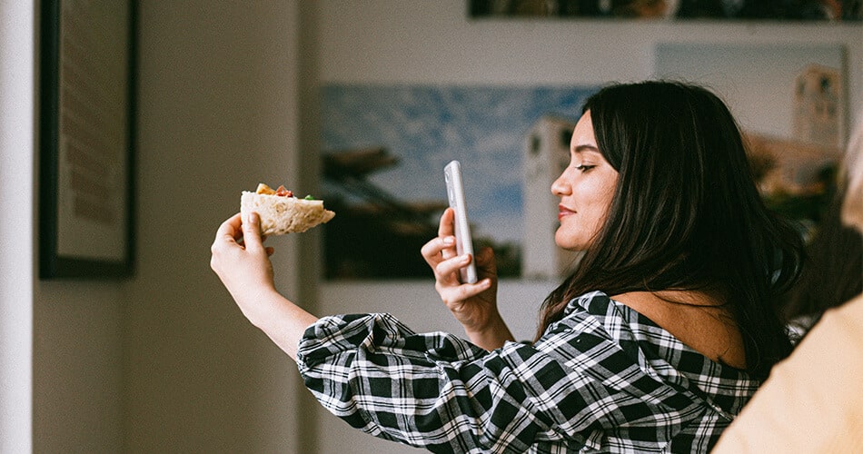 Social Media Influencer Taking Photo of Pizza